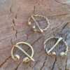 Set of 3 brass viking fibulas. Two types